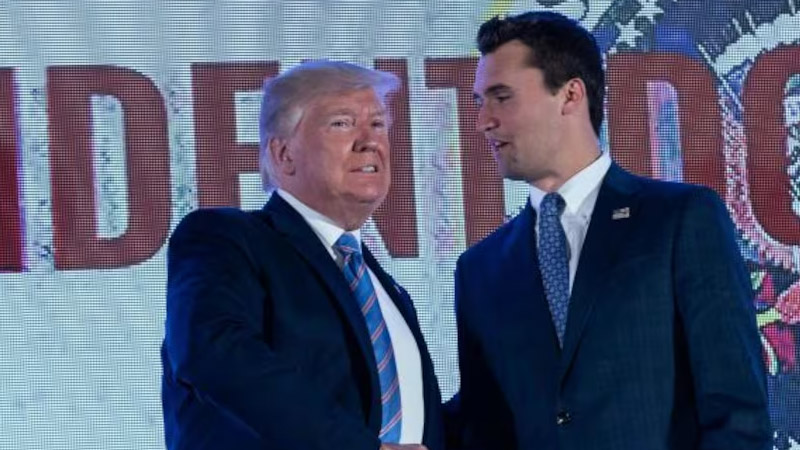Donald Trump shakes hands with Charlie Kirk
